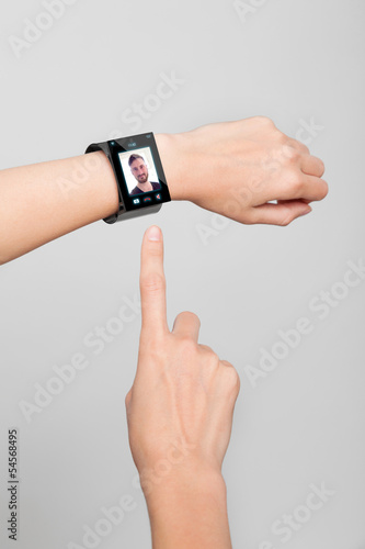 female wrist with a modern Internet Smart Watch