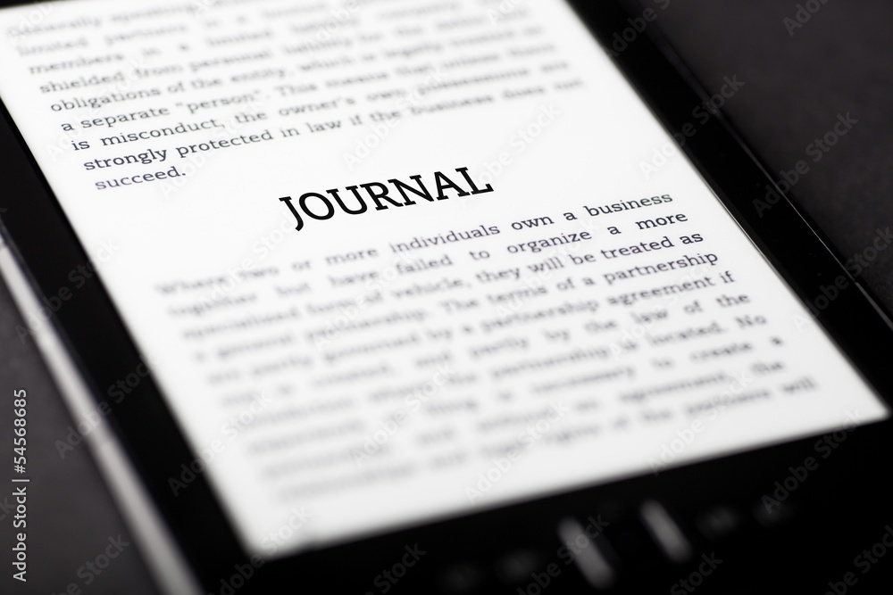Obraz premium Journal on tablet touchpad, ebook concept