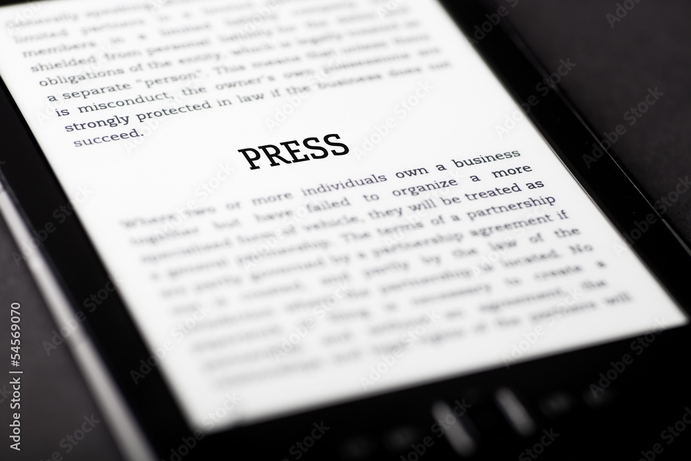 Press on tablet touchpad, ebook concept Press on tablet touchpad, ebook concept