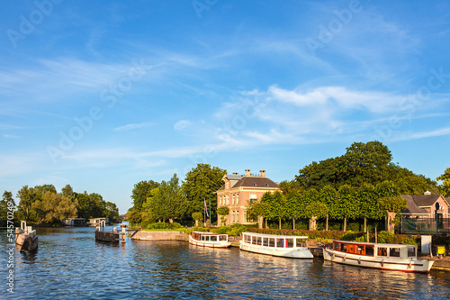 Classic small cruise boats on the famous Dutch river Vecht © Martin Bergsma