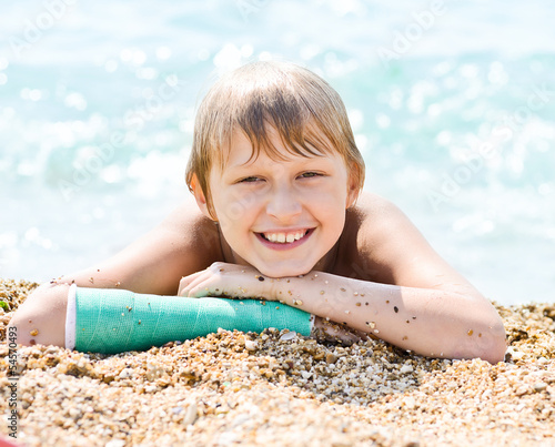 happy boy on sea shore