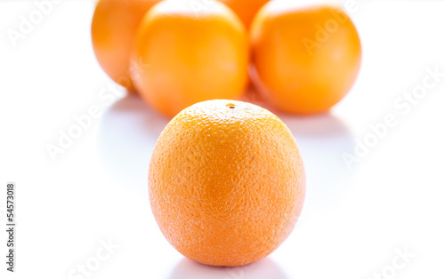 Orange with Oranges in Background