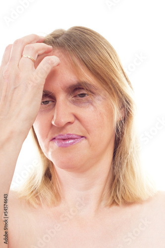 Mature woman having bad hangover after party