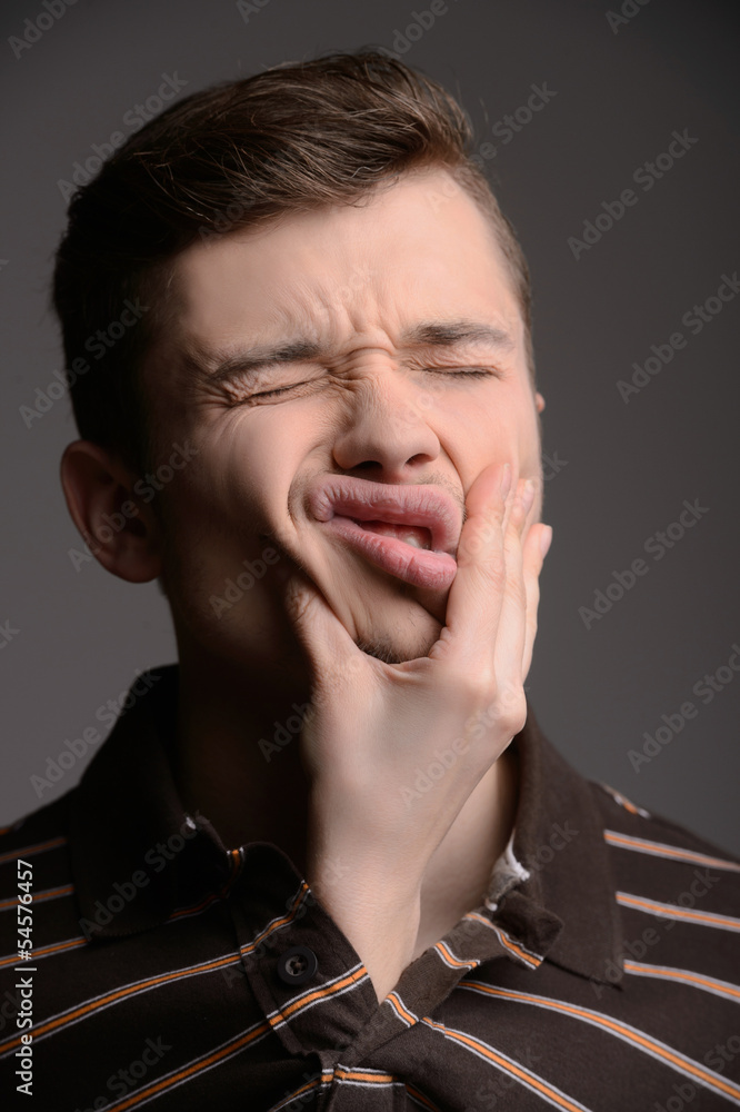 Men grimacing. Young men grimacing while isolated on white Men grimacing. Young men grimacing while isolated on white