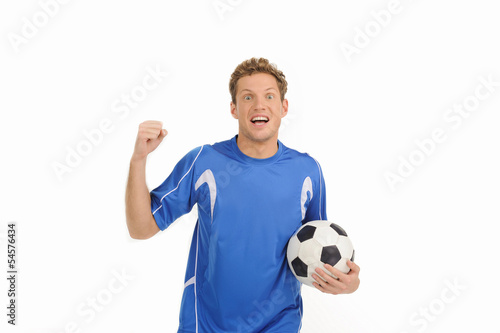 Handsome soccer player. Cheerful young soccer player gesturing w