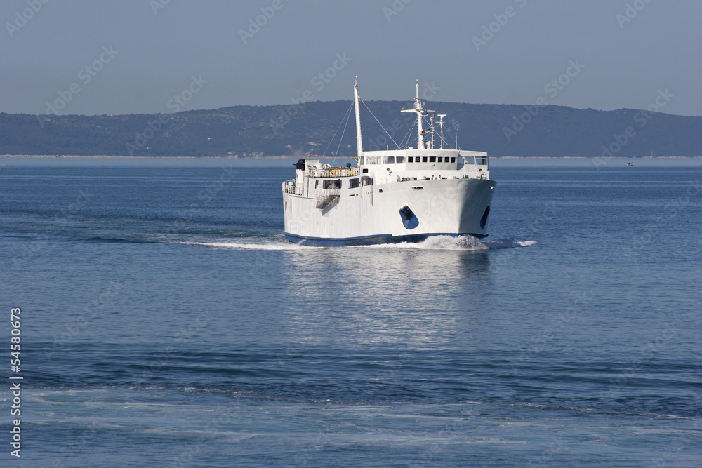 The passenger ship is coming in harbor Split from island