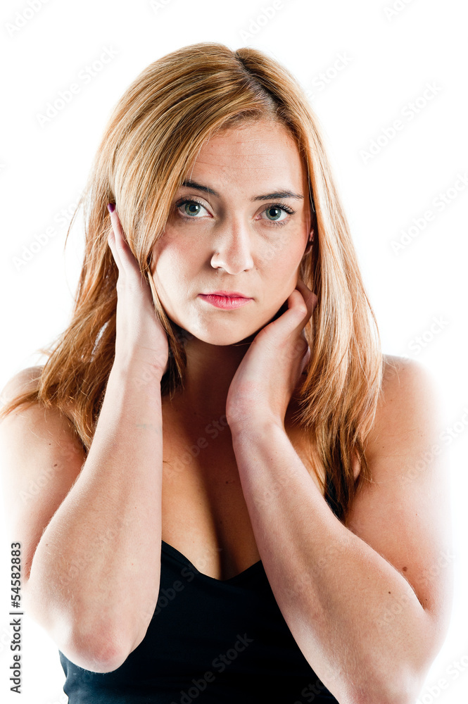 Young woman posing with her hands on her face Young woman posing with her hands on her face