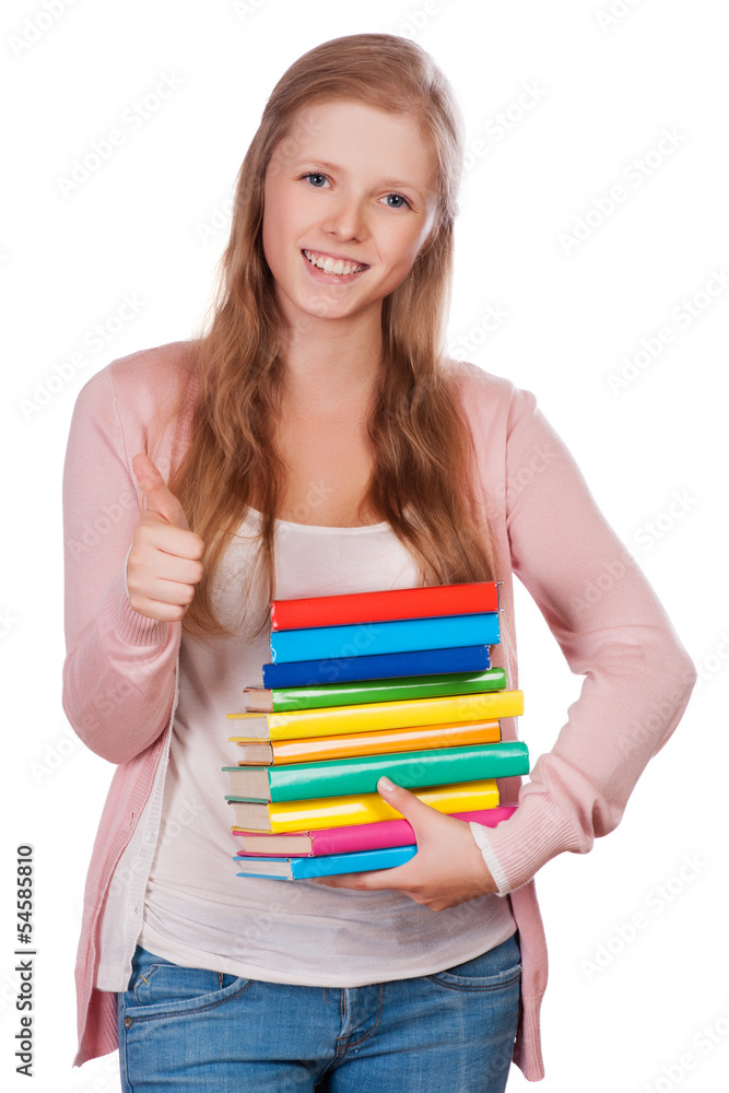Cute young student girl holding colorful exercise books. Cute young student girl holding colorful exercise books.