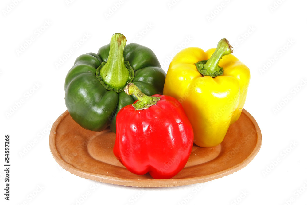sweet pepper in dish isolated on white background sweet pepper in dish isolated on white background