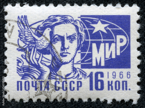 stamp printed in Russia showing a girl with pigeon