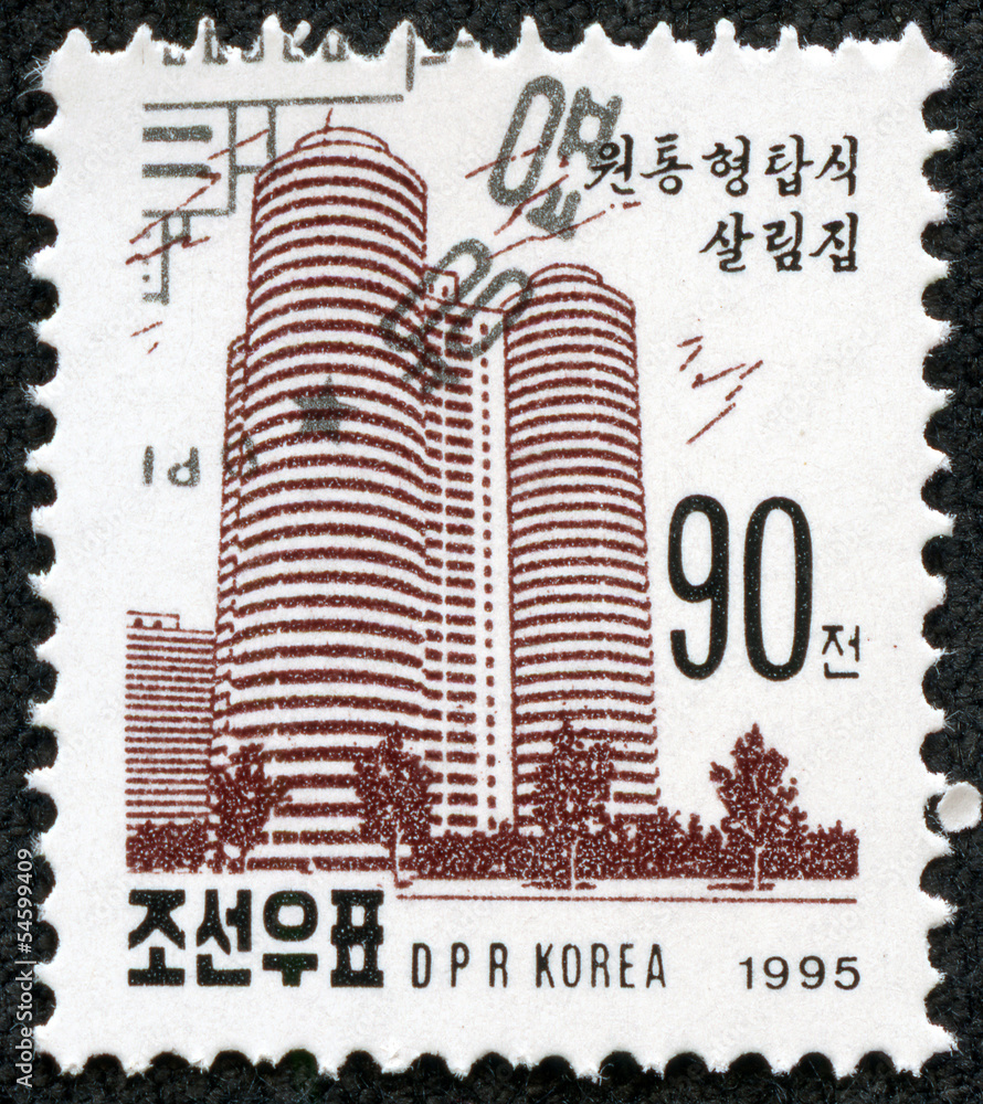Obraz premium stamp printed in North Korea shows a Tower apartment block