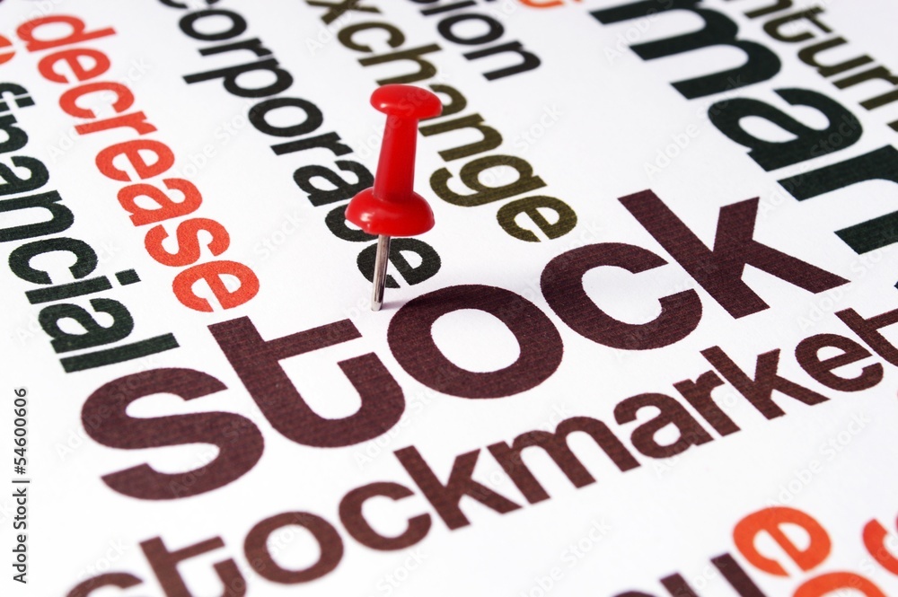 Fototapeta premium Push pin on stockmarket text