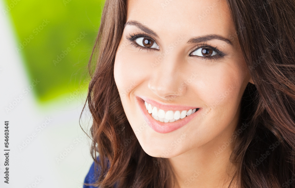 Happy smiling young woman, outdoors Happy smiling young woman, outdoors