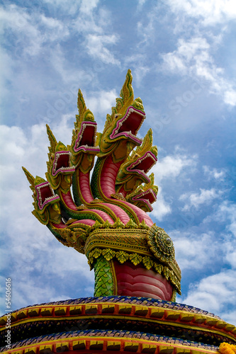 Serpent statue on background sky © yothin