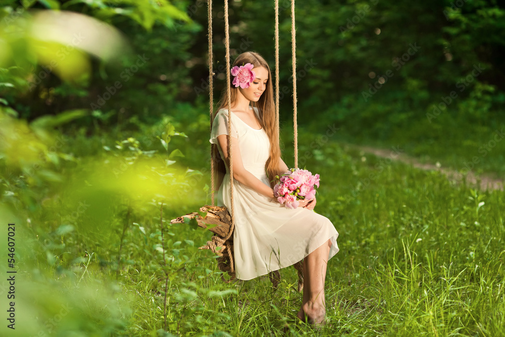 beautiful girl with bouquet of flowers in outdoor sitting on a s beautiful girl with bouquet of flowers in outdoor sitting on a s