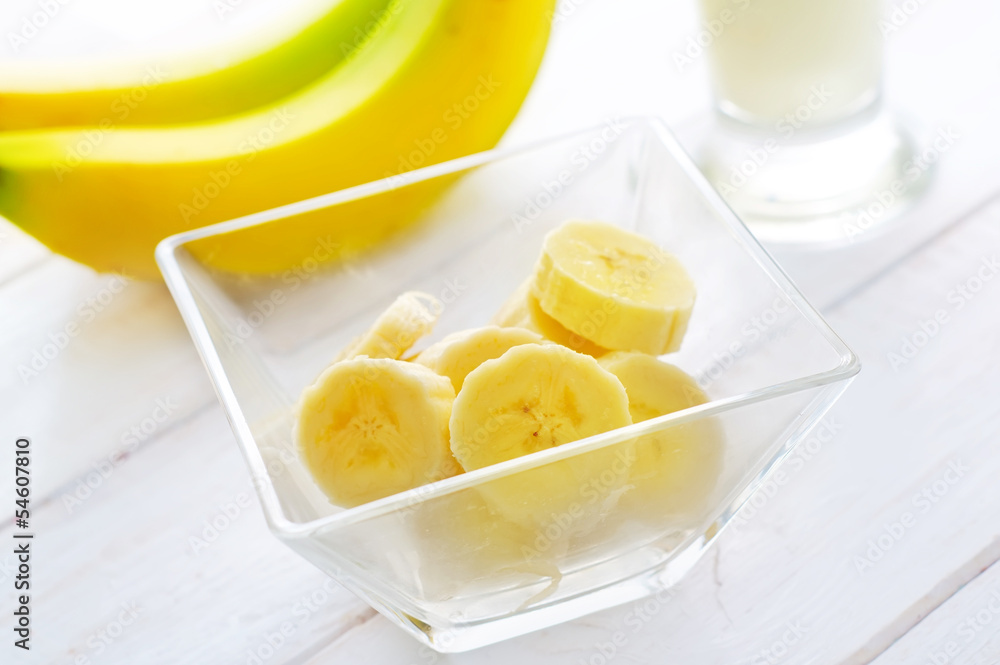 Fresh banana in the glass bowl, banana and milk Fresh banana in the glass bowl, banana and milk