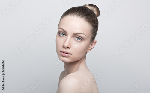 Portrait of beautiful young woman with clean and healthy face. N
