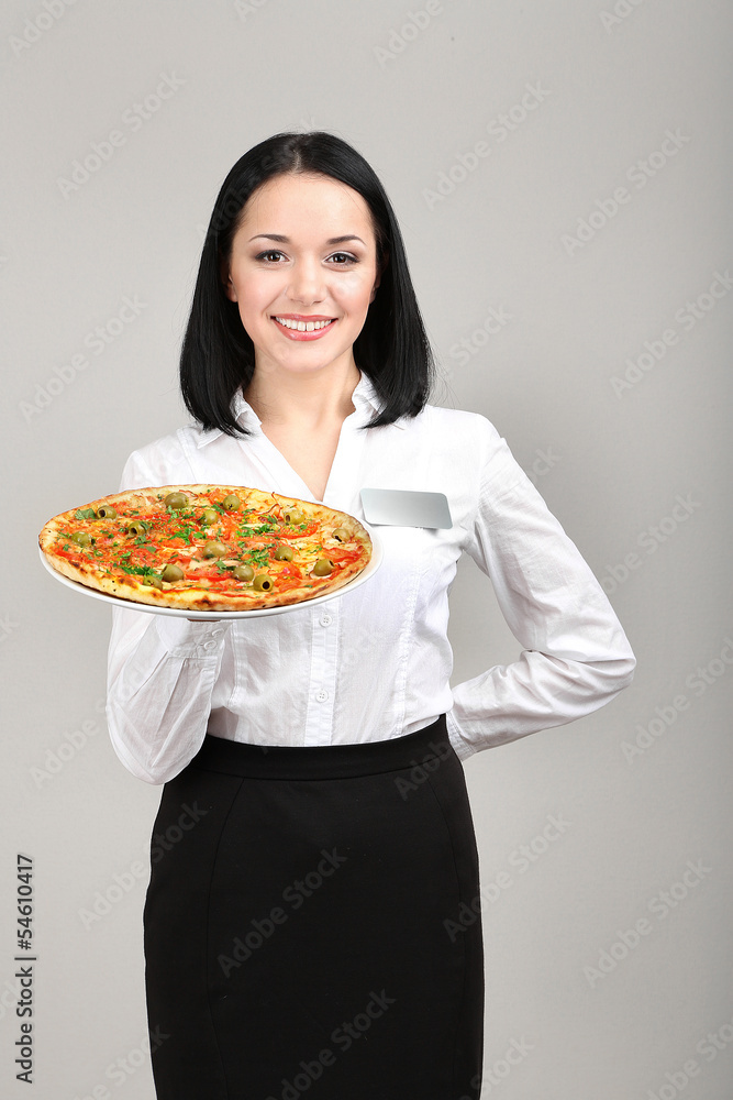 Beautiful girl waiter with pizza isolated on white Beautiful girl waiter with pizza isolated on white