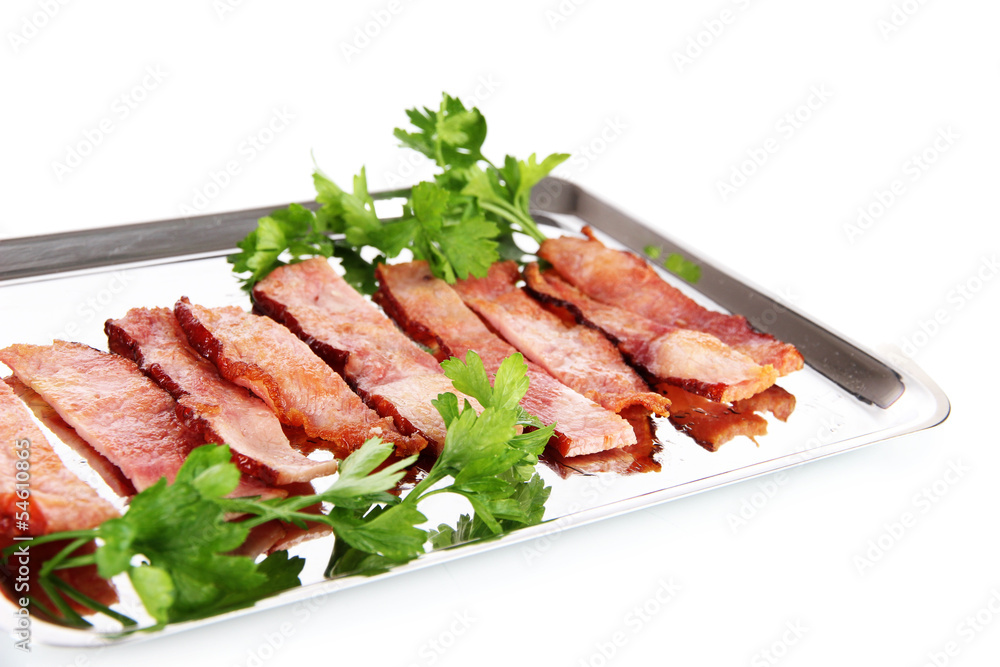 Fried bacon on metal tray isolated on white Fried bacon on metal tray isolated on white
