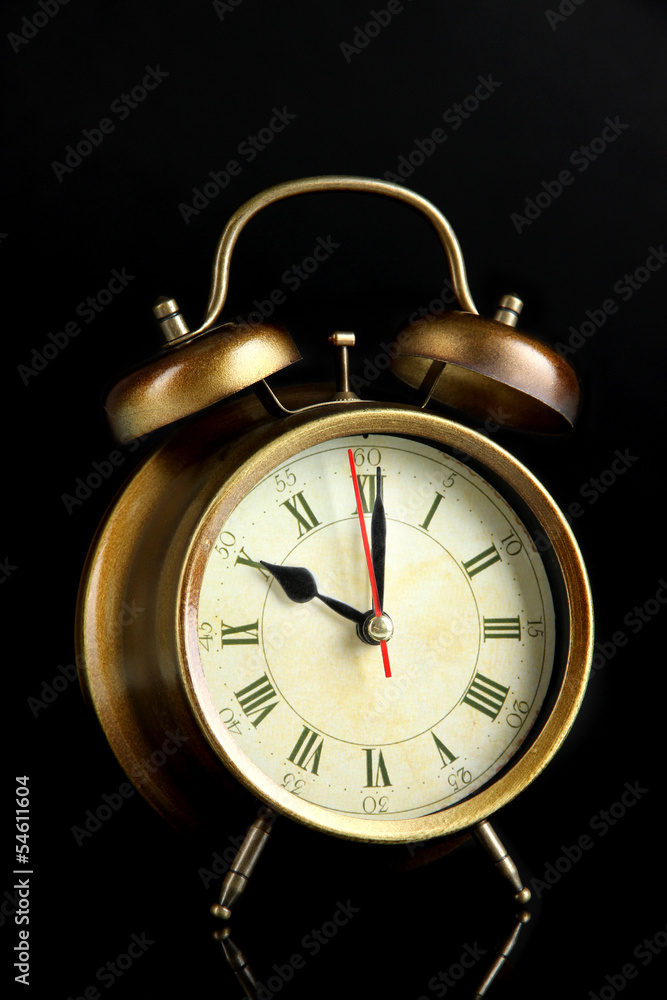 Old alarm clock isolated on black Old alarm clock isolated on black