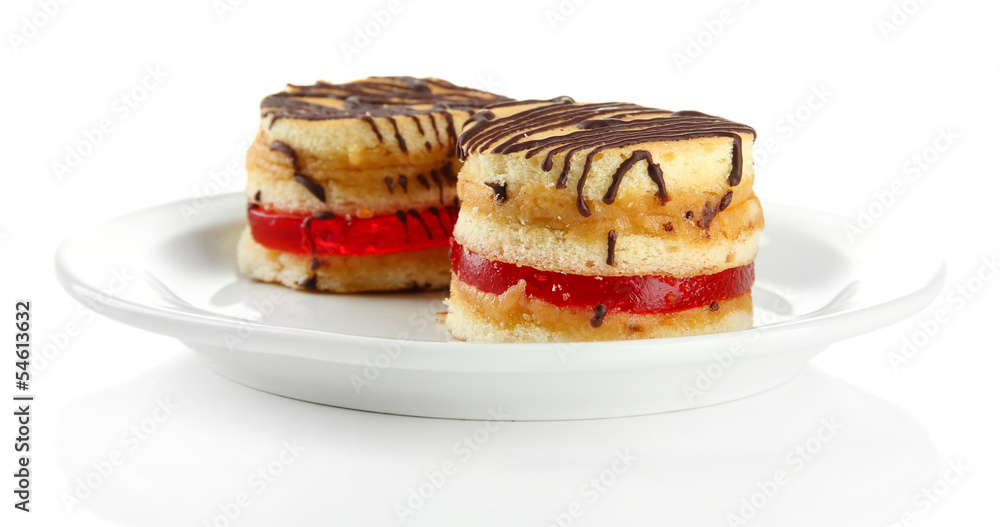 Tasty biscuit cakes on plate, isolated on white