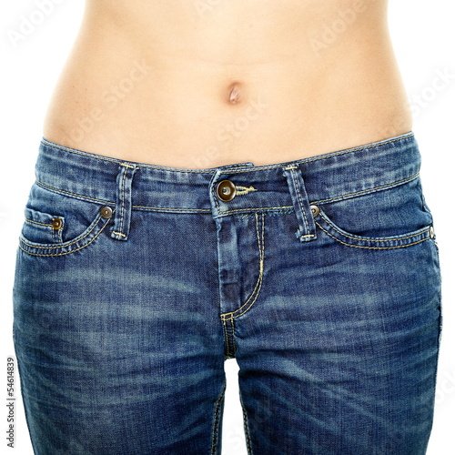 Woman waist wearing jeans. Weight loss stomach.