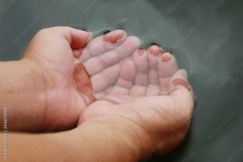 Two hand watering for drink