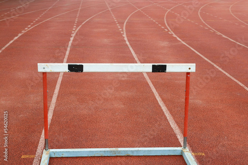 a hurdles on red running tracks