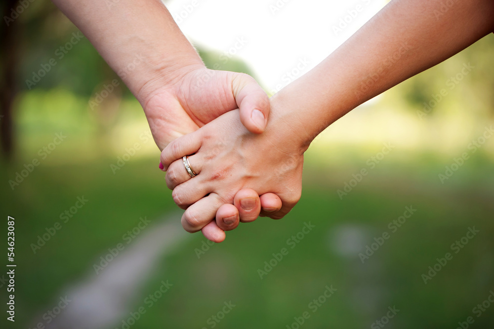 Hands of a loving couple. Concept of friendship Hands of a loving couple. Concept of friendship