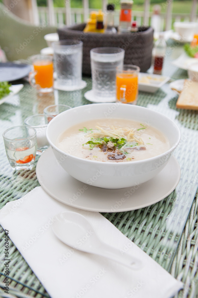 Traditional porridge rice gruel in bowl Traditional porridge rice gruel in bowl