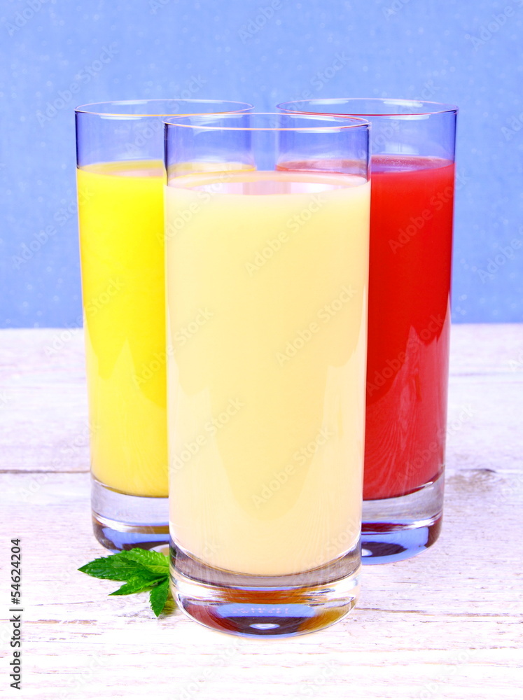 Oranges, bananas and grapefruit juice in glass Oranges, bananas and grapefruit juice in glass