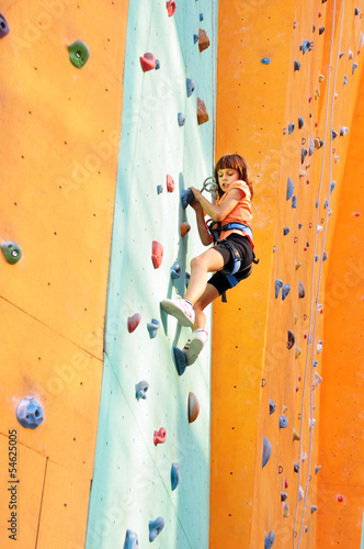 child climbing up the wall