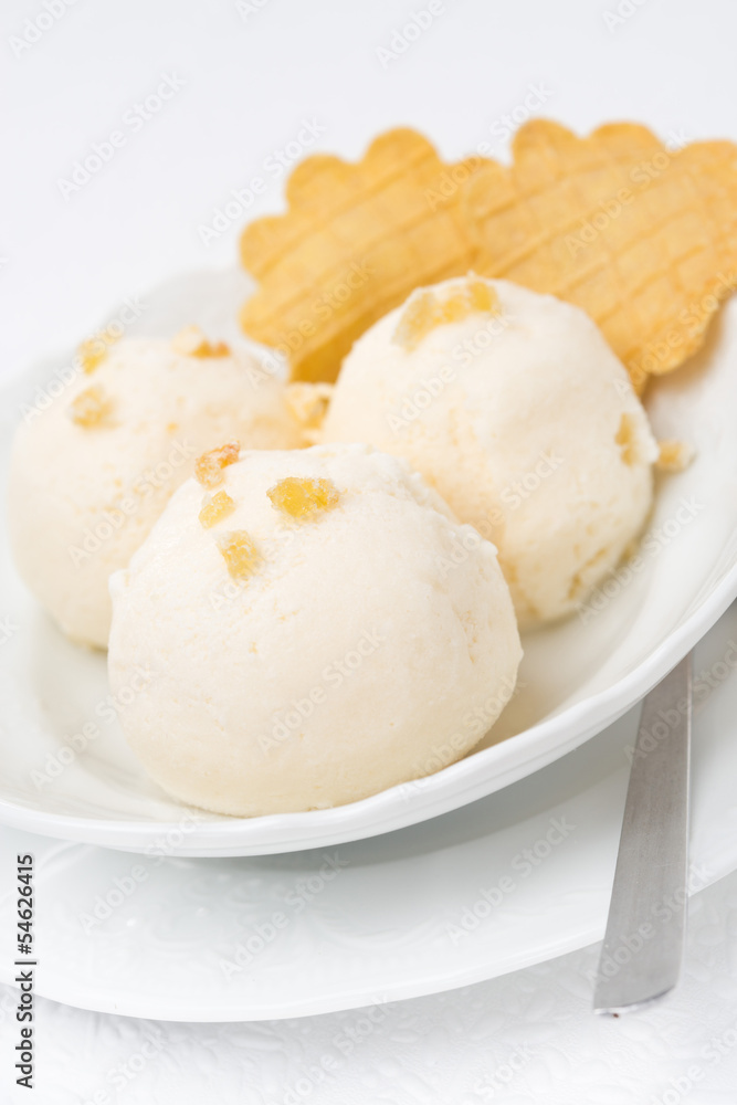 Ginger ice cream with melted milk, thin waffles close-up Ginger ice cream with melted milk, thin waffles close-up