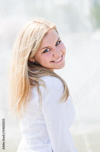 Beautiful young blond woman outdoors portrait