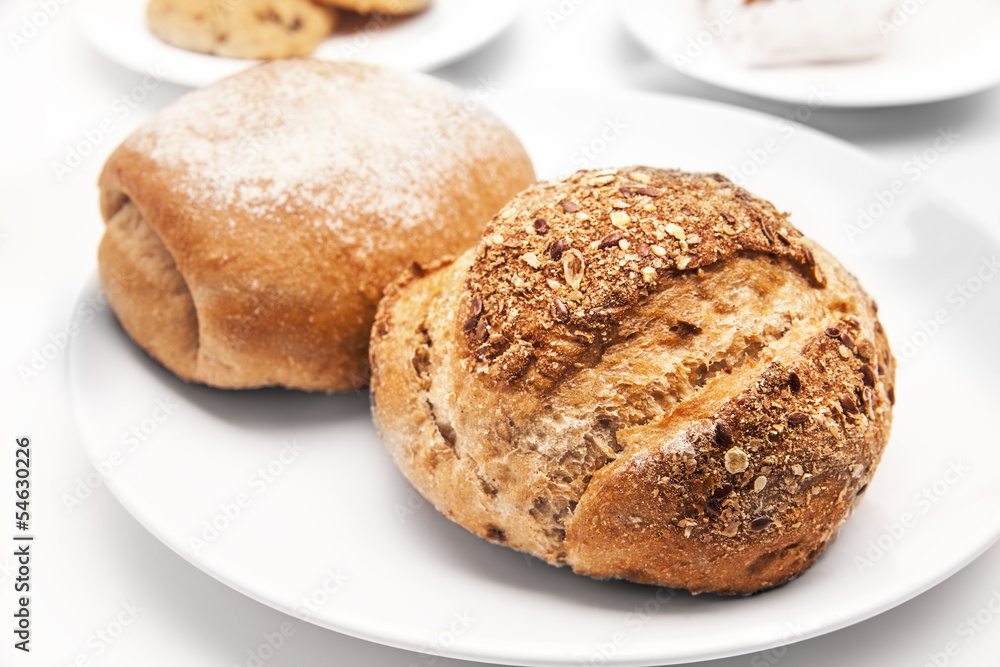 Fresh breads on white background.