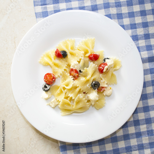 Pasta ribbons, cherry tomatoes and olives