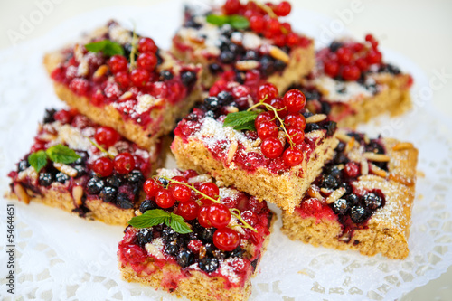 Fresh baked red and black currant berries cake