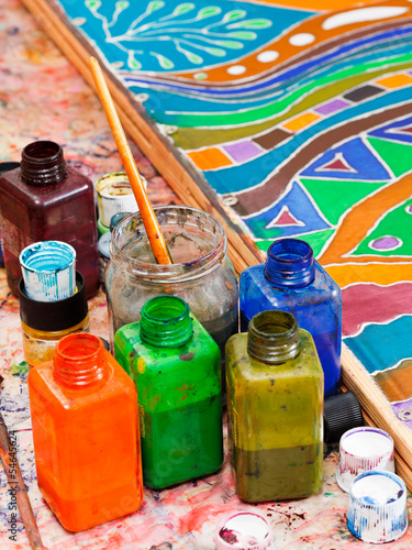 paintbrushes and bottles with pigments