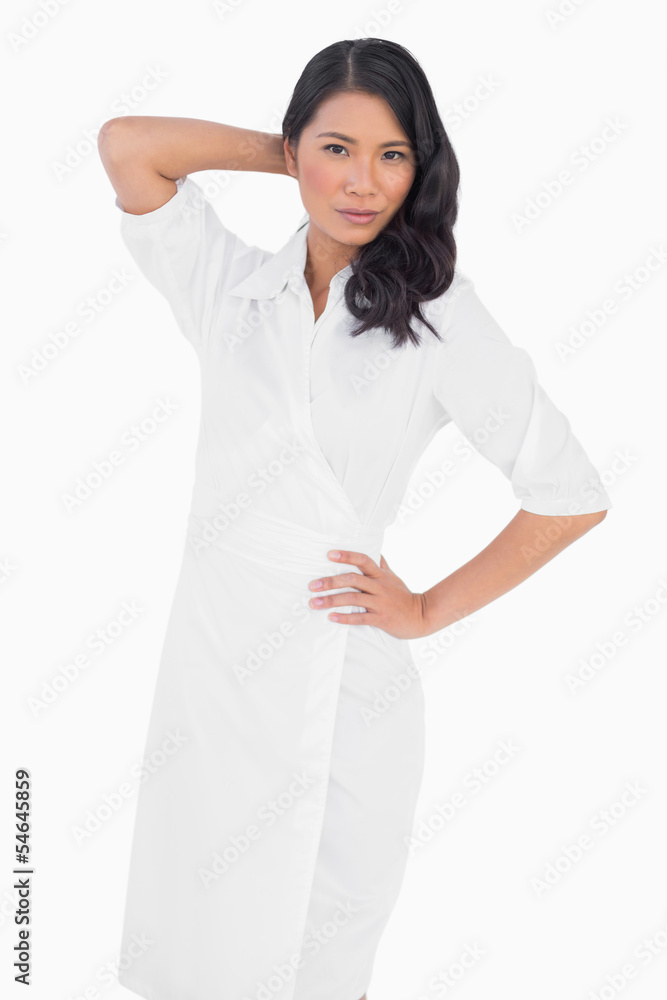 Elegant dark haired model with white dress posing Elegant dark haired model with white dress posing