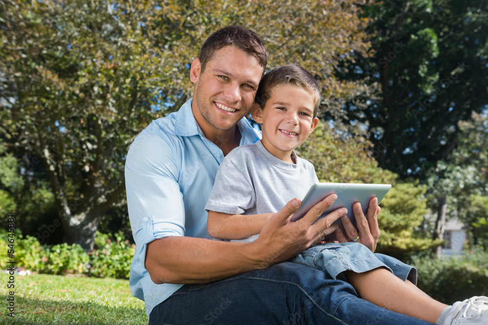 Happy dad and son with a tablet pc Happy dad and son with a tablet pc