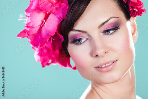 Woman Face With Pink Flowers. Perfect Skin. Professional Make-up