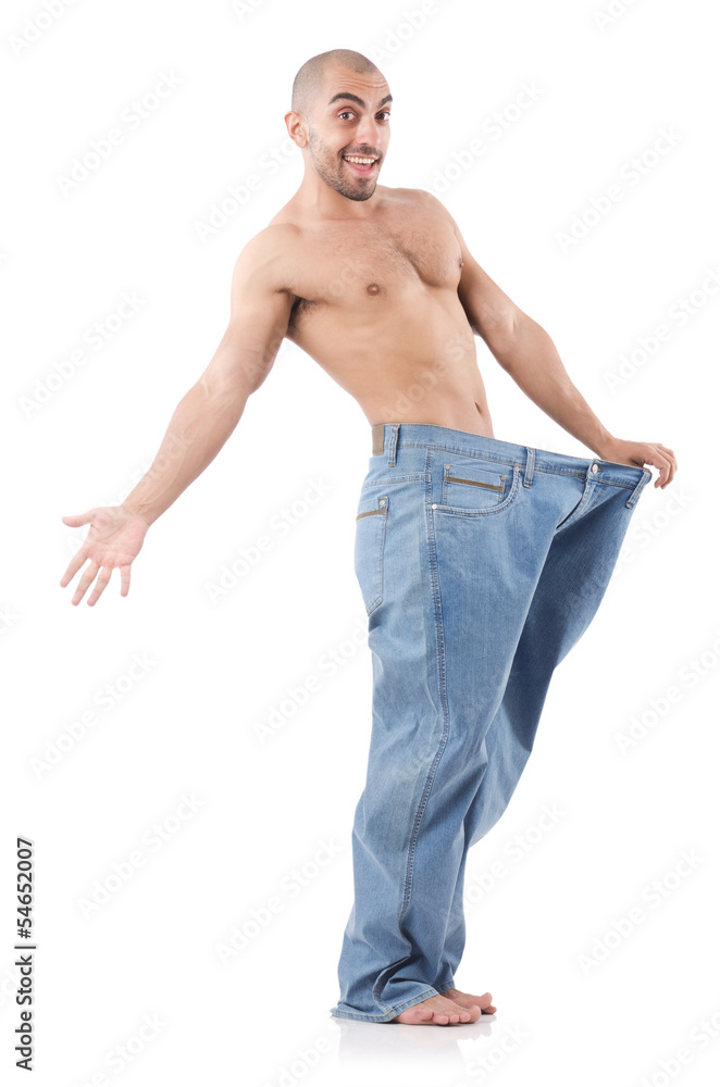 Fototapeta premium Man in dieting concept with oversized jeans
