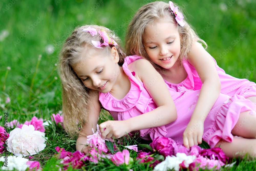 portrait of two twins with peonies portrait of two twins with peonies