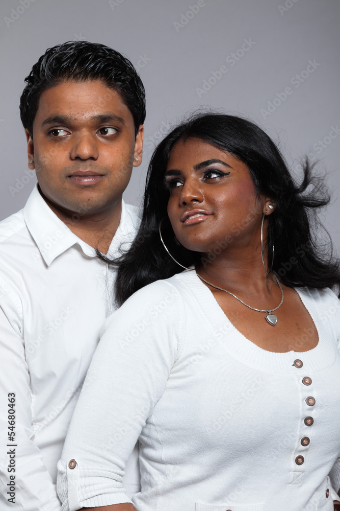 Young romantic indian couple. Wearing white shirt and jeans. Stu Young romantic indian couple. Wearing white shirt and jeans. Stu