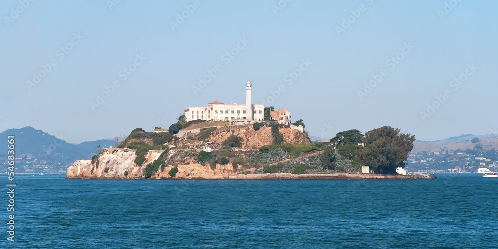 Alcatraz jail island in San Francisco bay with a beautiful blue