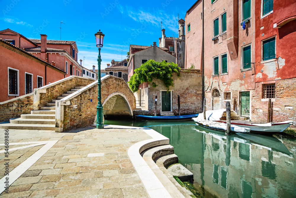 Naklejka premium Venice cityscape, water canal, bridge and traditional buildings.
