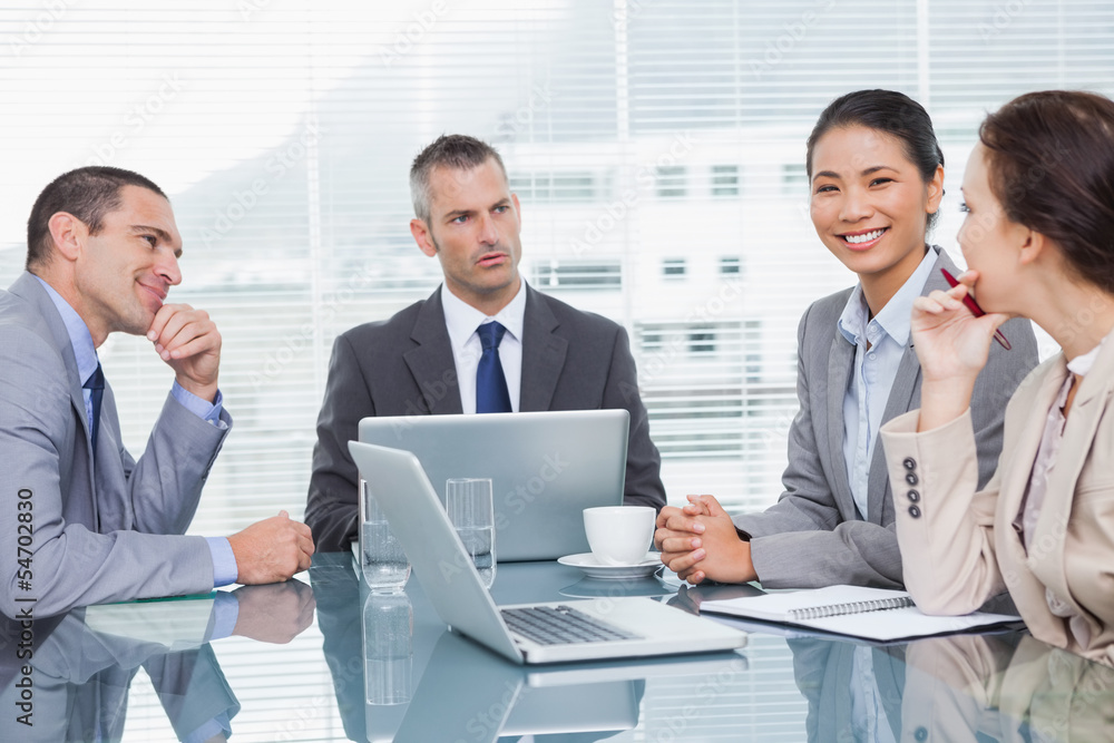 Business people working together over coffee