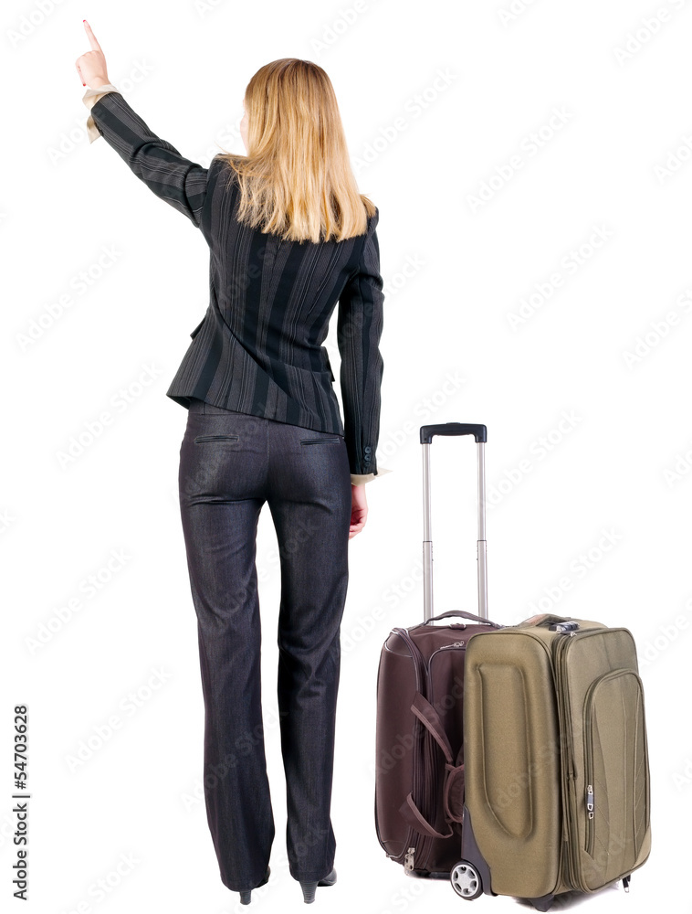 Back view of pointing business woman with suitcase looking up. Back view of pointing business woman with suitcase looking up.
