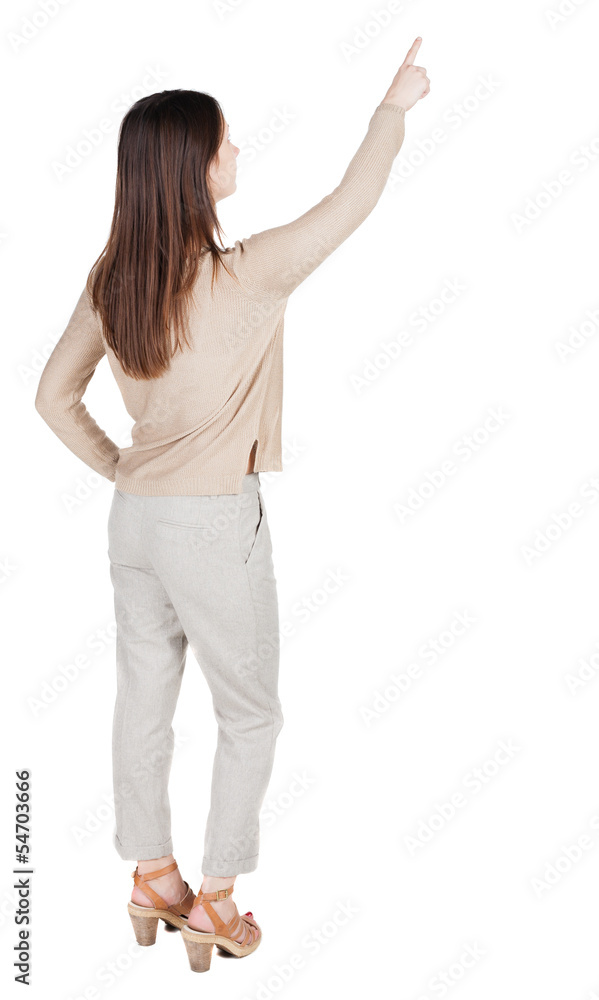 Back view of pointing woman. Back view of pointing woman.
