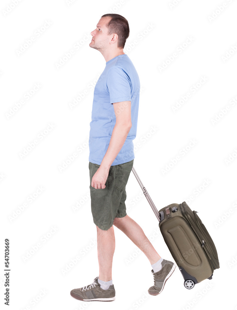 back view of walking man with suitcase. back view of walking man with suitcase.